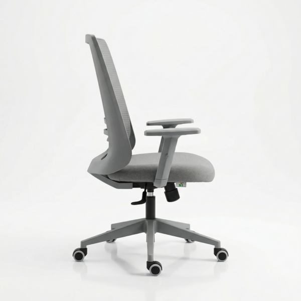 EliteMesh Pro mid-back office chair positioned at a modern work-from-home desk, featuring an official 5-year warranty badge.