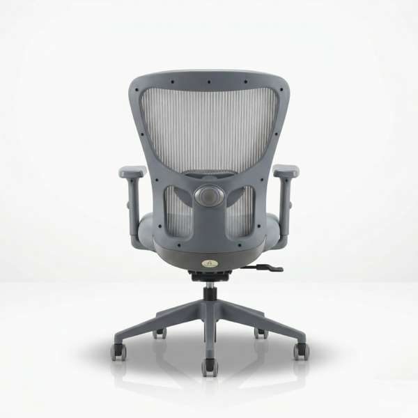 Jazz MB premium grey ergonomic office chair positioned at a modern wooden study desk, featuring a 5-year warranty and DIY assembly badge.